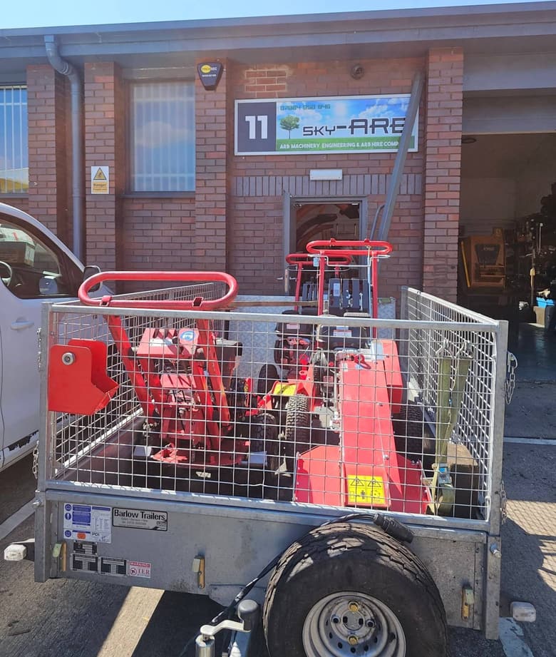 Dewar Court: the Sky-Arb workshop with a trailer of stump grinders outside